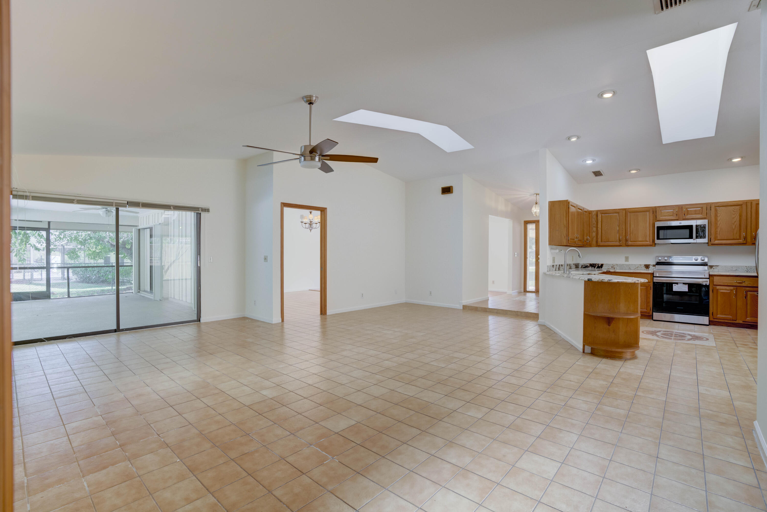 15 Dunbar Road Palm Beach Gardens, FL 33418 - Photo 35 of 45 Family Room Overlooking Kitchen - Foyer