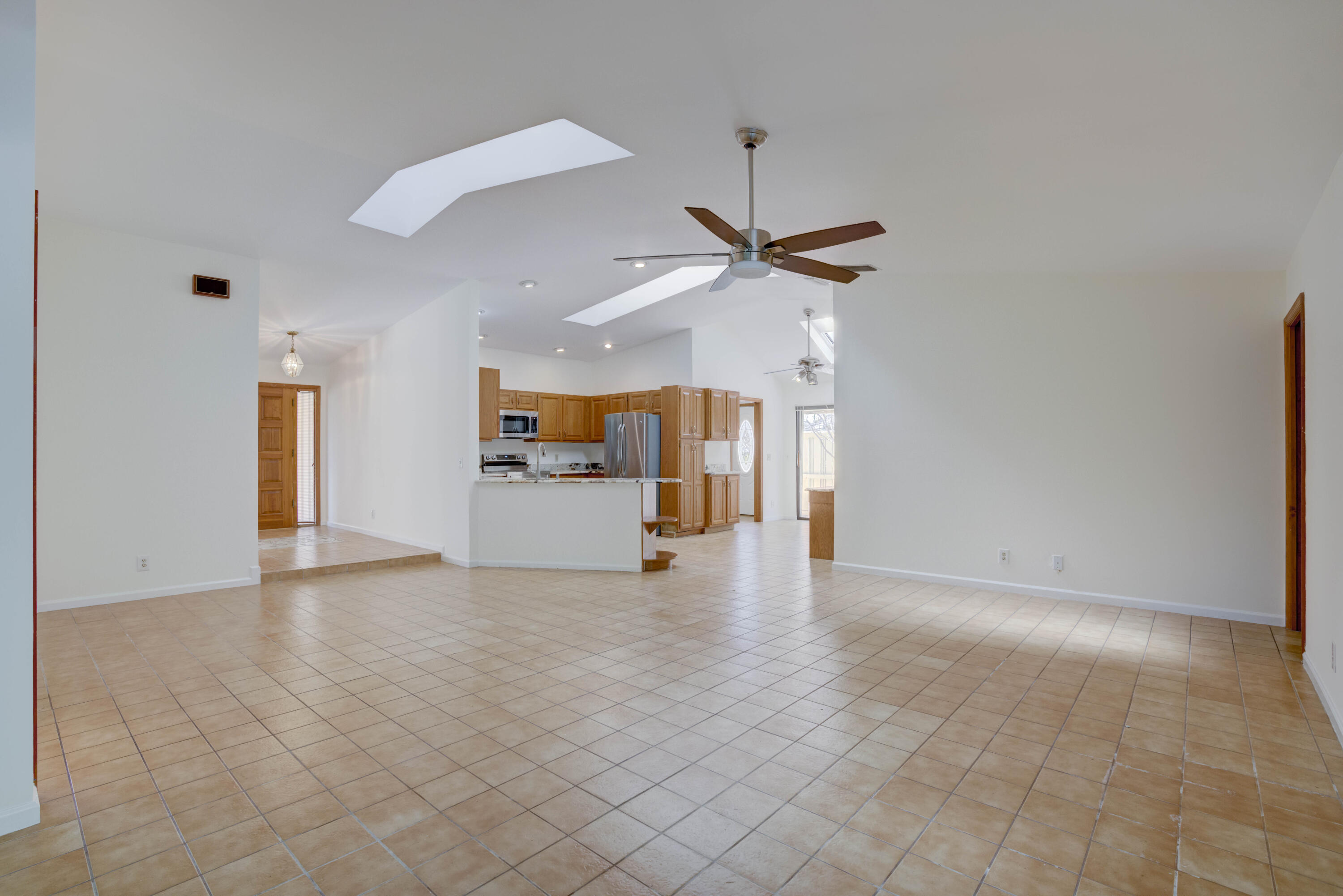 15 Dunbar Road Palm Beach Gardens, FL 33418 - Photo 36 of 45 Family Room Overlooking Kitchen - Foyer