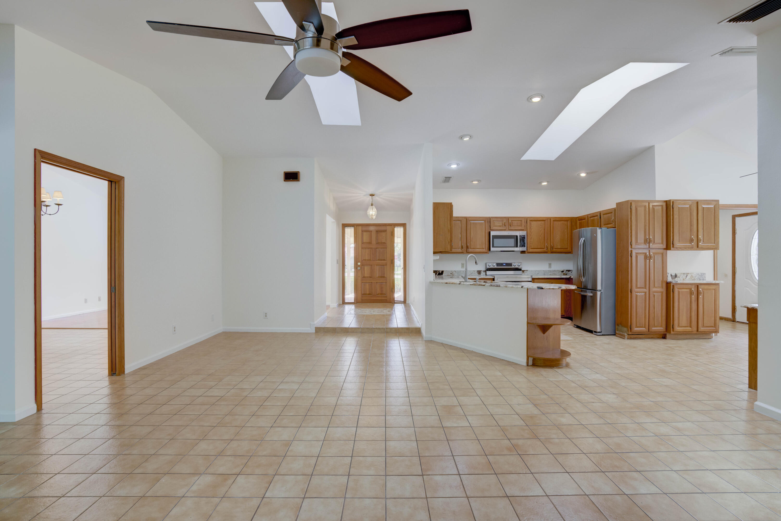 15 Dunbar Road Palm Beach Gardens, FL 33418 - Photo 37 of 45 Family Room Overlooking Kitchen Foyer -