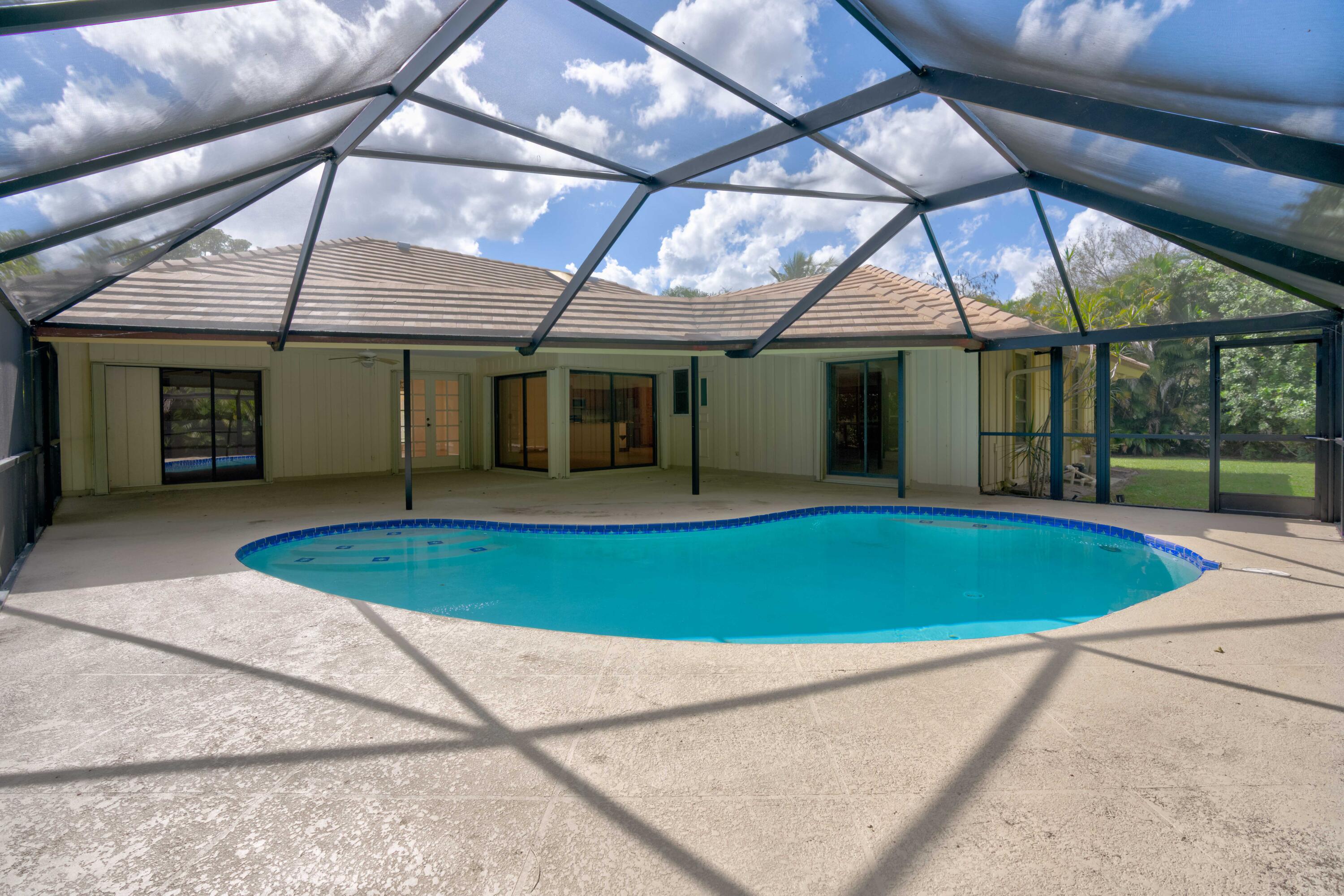 15 Dunbar Road Palm Beach Gardens, FL 33418 - Photo 38 of 45 Screened In Patio/Pool Area