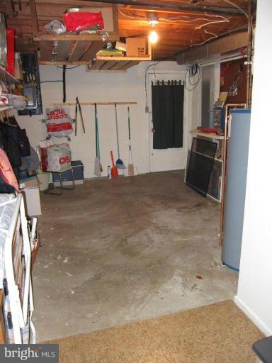 604 Lowander Lane Silver Spring, MD 20901 - Photo 23 of 30 Large storage room in basement with door out