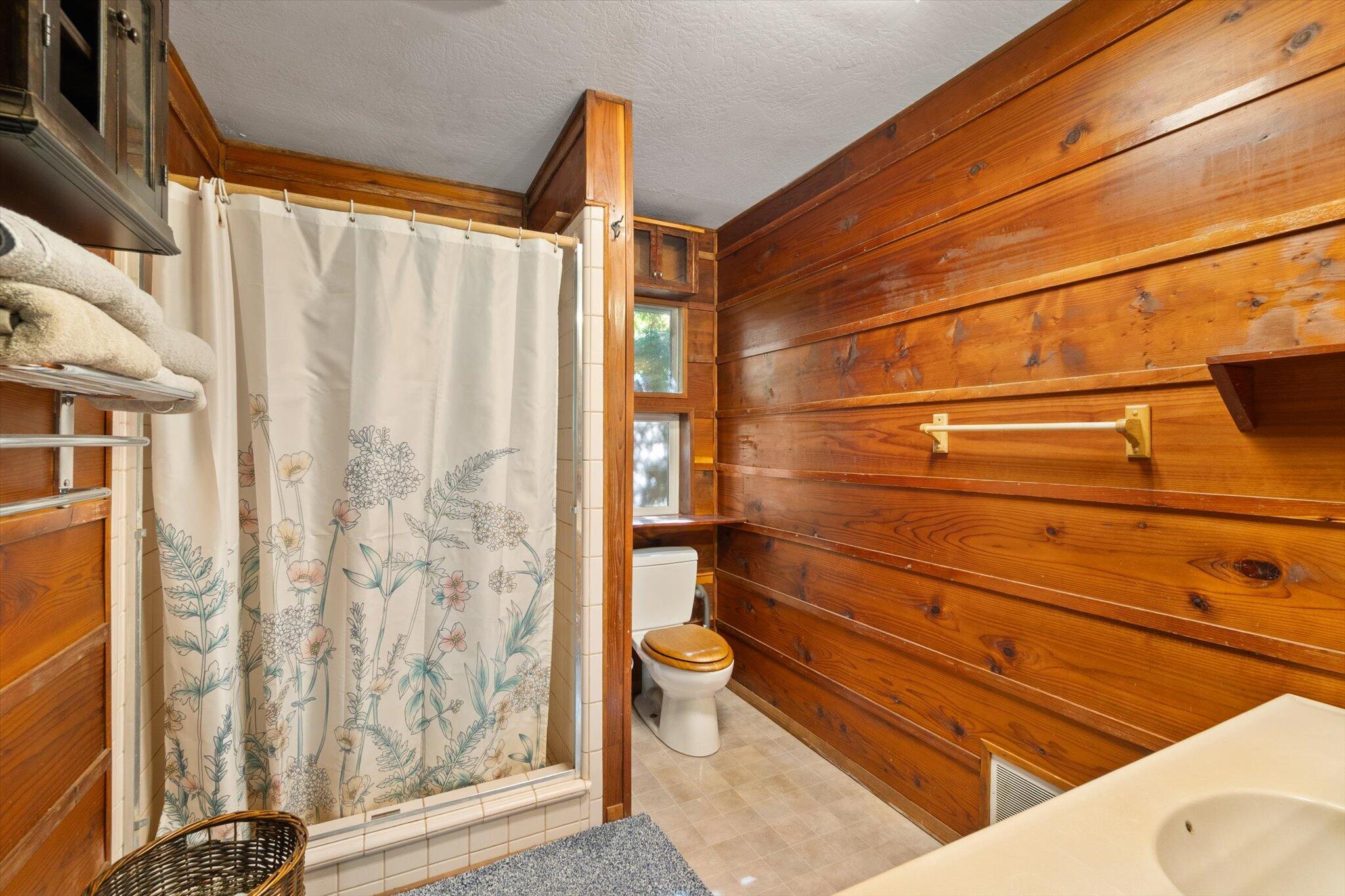 28449 Whippoorwill Circle Shingletown, CA 96088 - Photo 14 of 52 a bathroom with a toilet and shower curtain