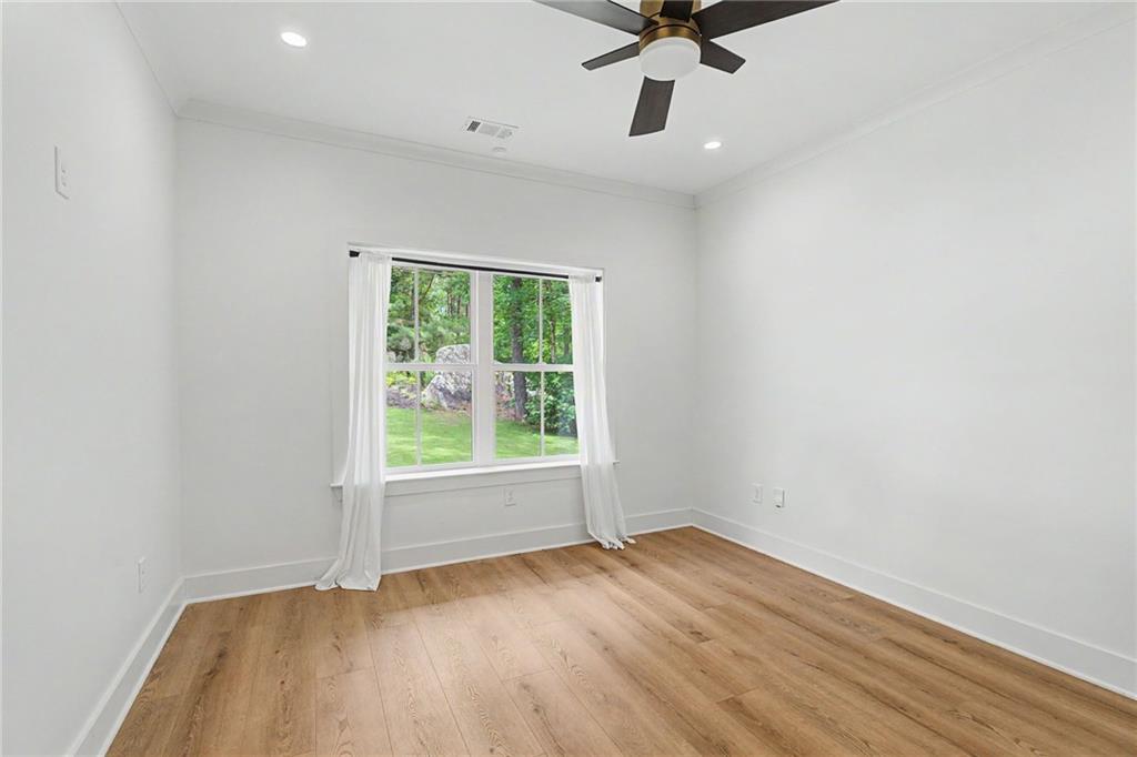 376 Hunnicut Road Southeast Mableton, GA 30126 - Photo 45 of 73 wooden floor in an empty room with a window
