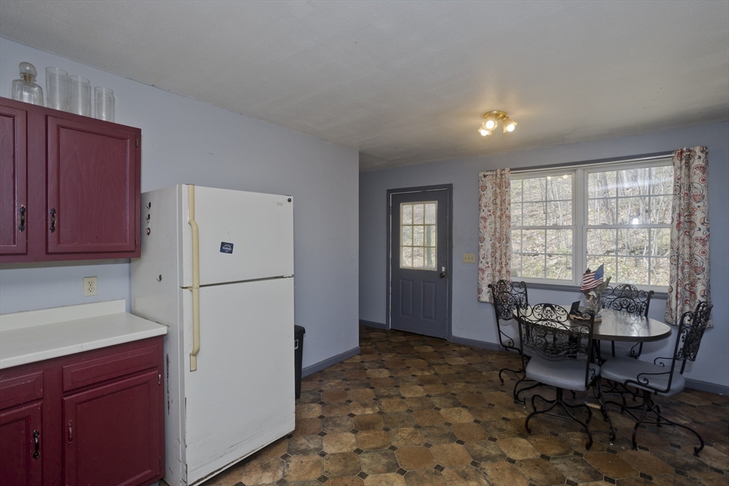 300 Middlefield Road Chester, MA 01011 - Photo 17 of 40 a view of a dining room with furniture window and outside view