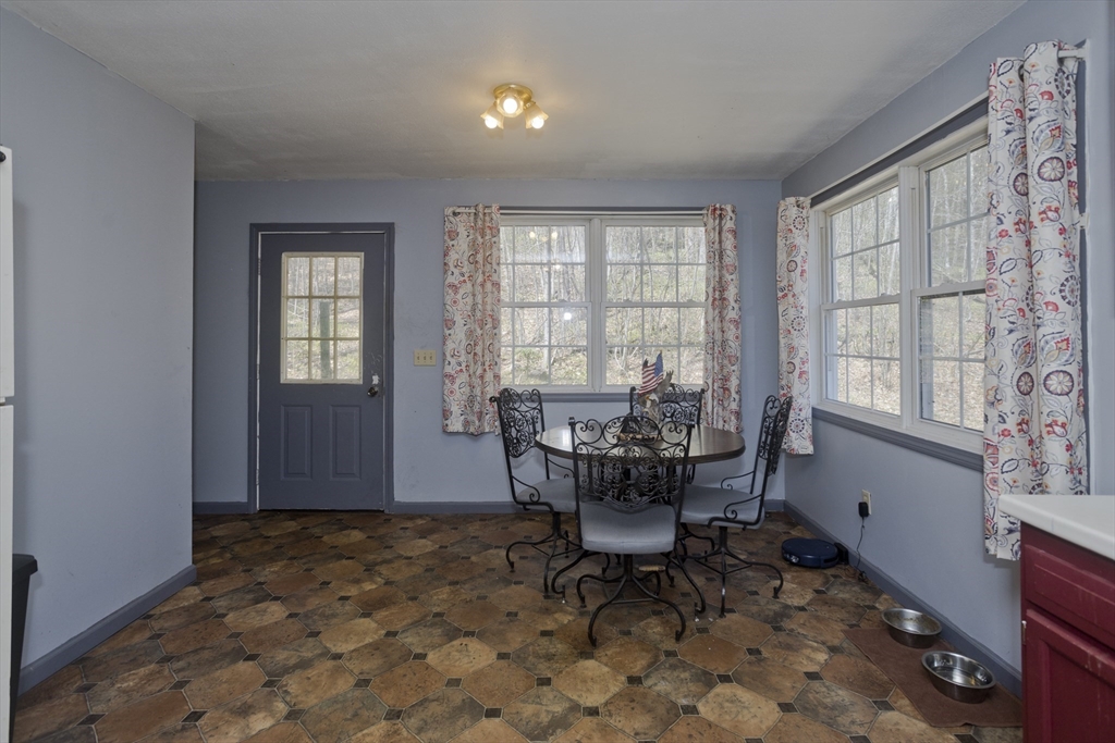 300 Middlefield Road Chester, MA 01011 - Photo 18 of 40 a view of a dining room with furniture window and outside view
