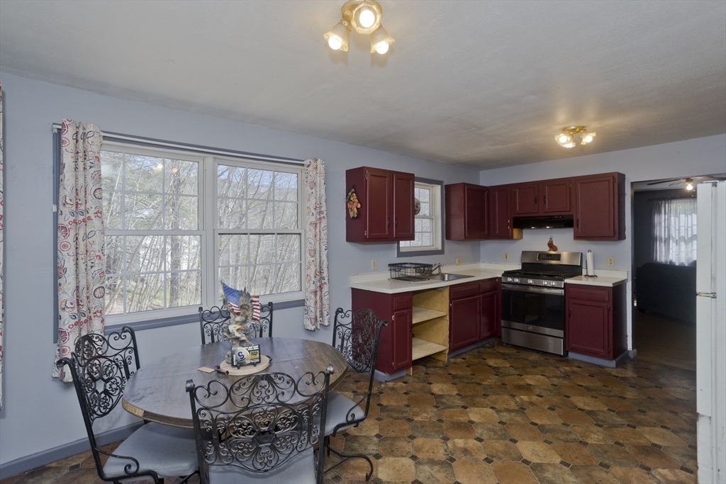 300 Middlefield Road Chester, MA 01011 - Photo 21 of 40 a kitchen with stainless steel appliances granite countertop a stove top oven a sink dishwasher and a refrigerator