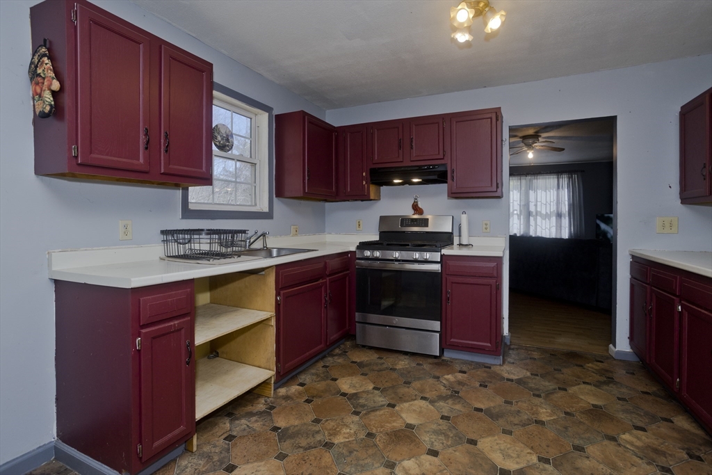 300 Middlefield Road Chester, MA 01011 - Photo 23 of 40 a kitchen with stainless steel appliances granite countertop a stove refrigerator sink and cabinets