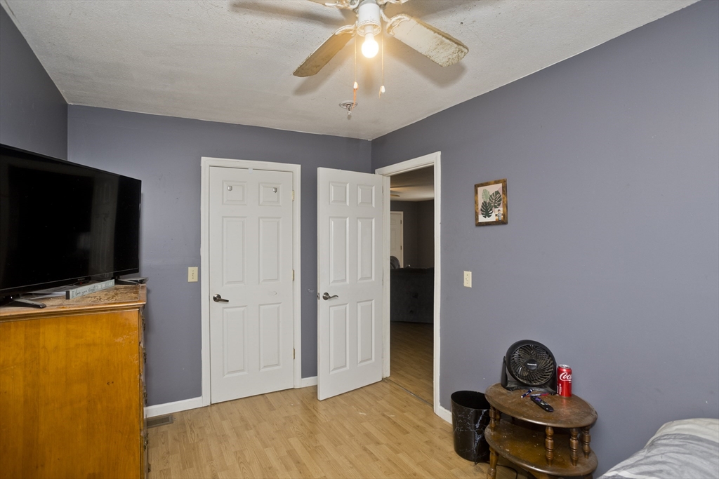 300 Middlefield Road Chester, MA 01011 - Photo 34 of 40 a room with closet and wooden floor