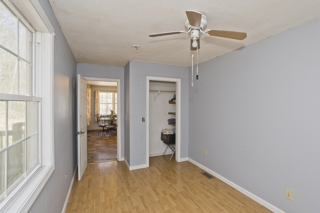 300 Middlefield Road Chester, MA 01011 - Photo 36 of 40 a view of empty room with wooden floor and fan