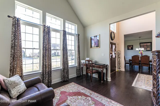a view of a living room with hardwood floor