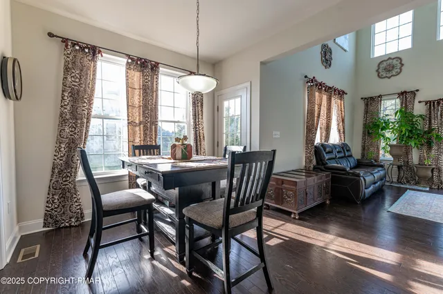 a kitchen with stainless steel appliances granite countertop a stove top oven and a refrigerator