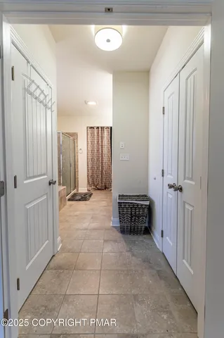 a view of hallway with wooden floor