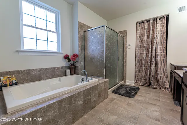 a bed room with a bed and a chair