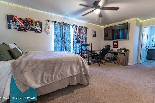 a view of a studio with wooden floor