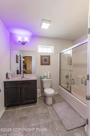 a living room with couch and a wooden floor