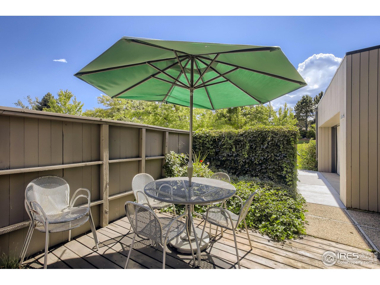 365 Quail Circle Boulder, CO 80304 - Photo 11 of 29 a backyard of a house with table and chairs