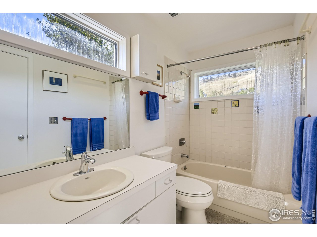 365 Quail Circle Boulder, CO 80304 - Photo 18 of 29 a bathroom with a sink a toilet and shower