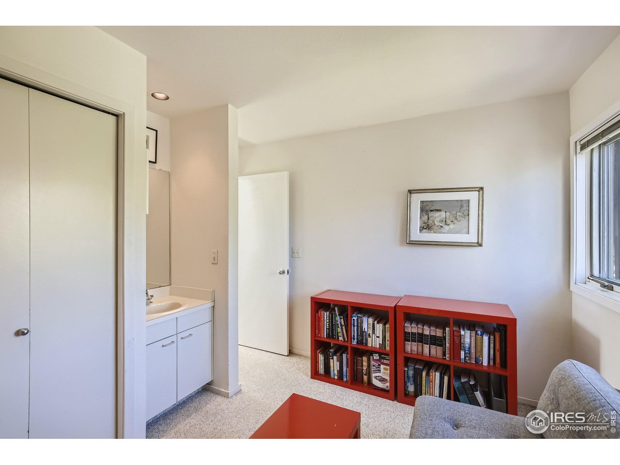 365 Quail Circle Boulder, CO 80304 - Photo 21 of 29 a living room with a couch and a bookshelf