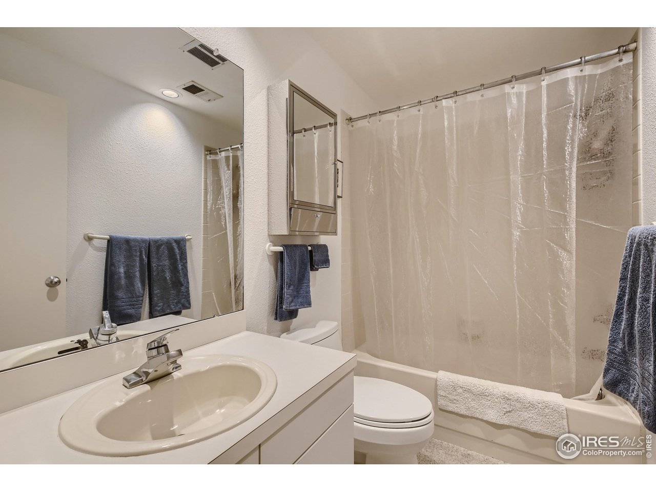 365 Quail Circle Boulder, CO 80304 - Photo 24 of 29 a bathroom with a sink toilet and shower