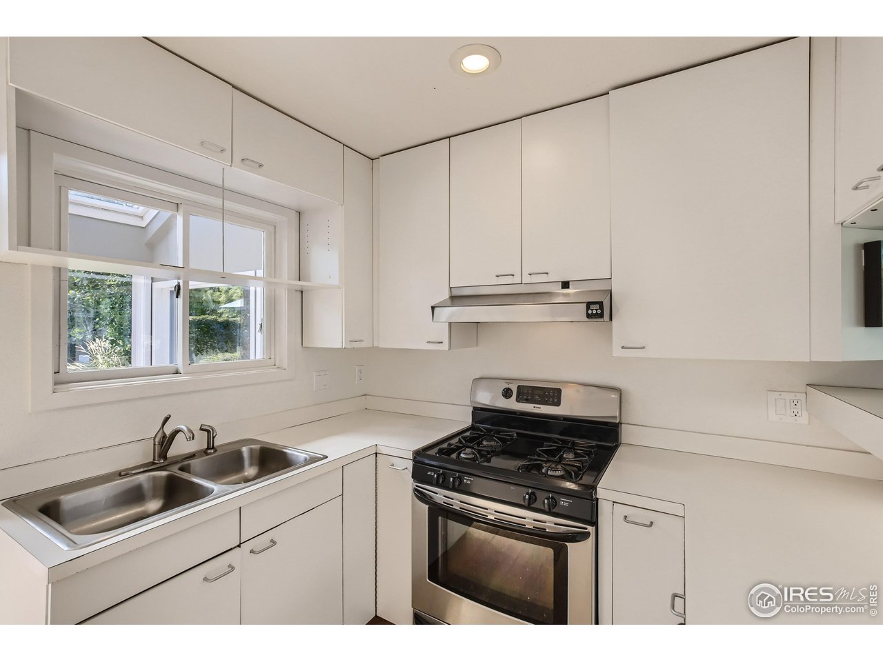 365 Quail Circle Boulder, CO 80304 - Photo 7 of 29 a kitchen with appliances cabinets and a sink