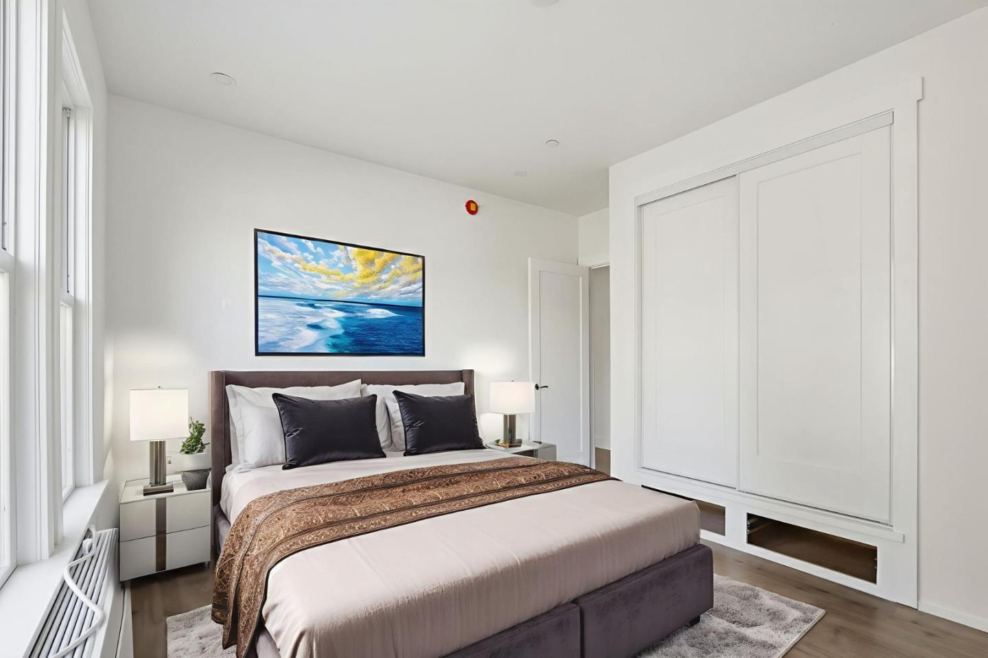 140 East Reed Street, Unit 3 San Jose, CA 95112 - Photo 2 of 8 a bedroom with a bed and a window