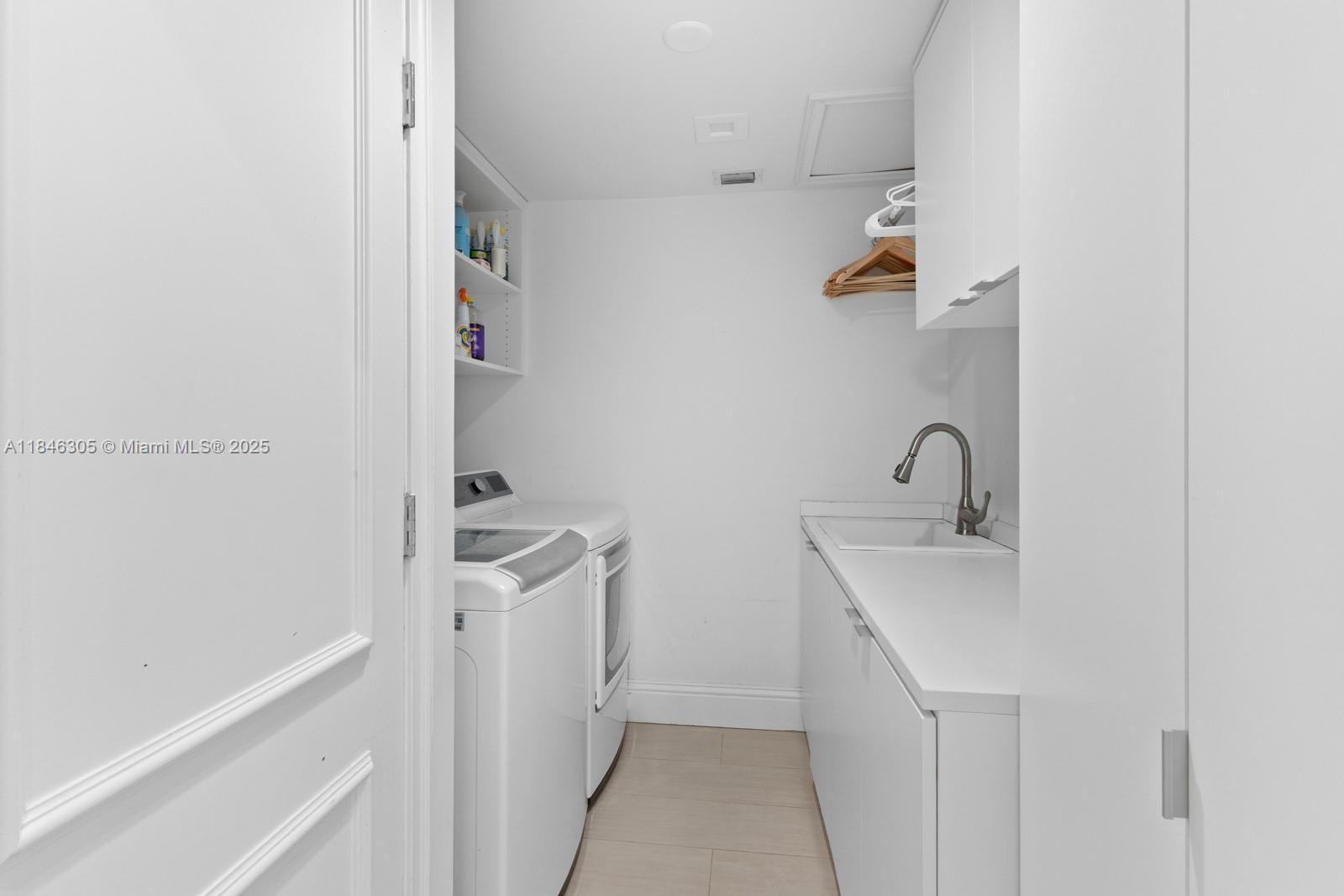 5 Coconut Lane Key Biscayne, FL 33149 - Photo 11 of 41 a bathroom with a sink and mirror