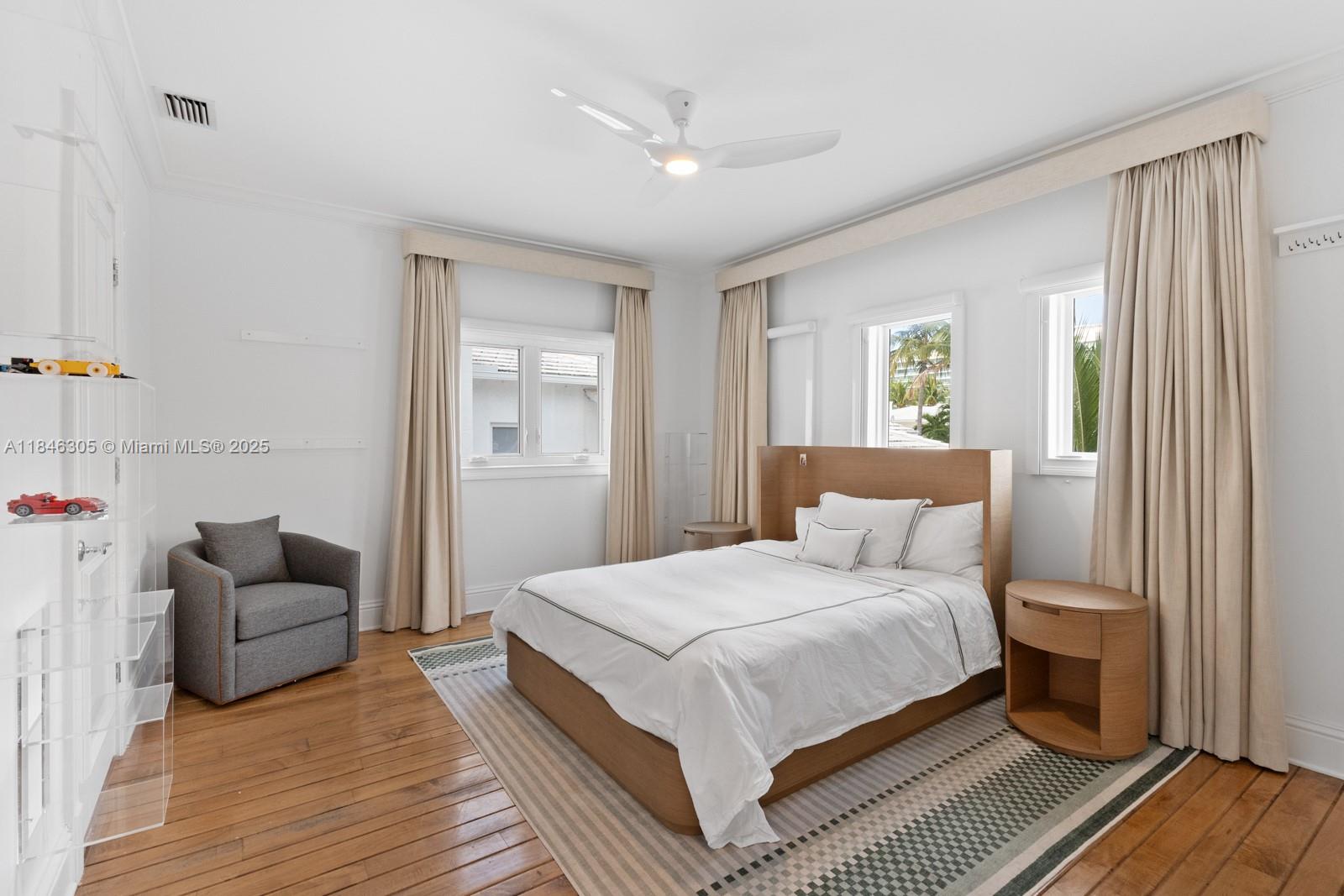 5 Coconut Lane Key Biscayne, FL 33149 - Photo 16 of 41 a bedroom with a bed and a couch