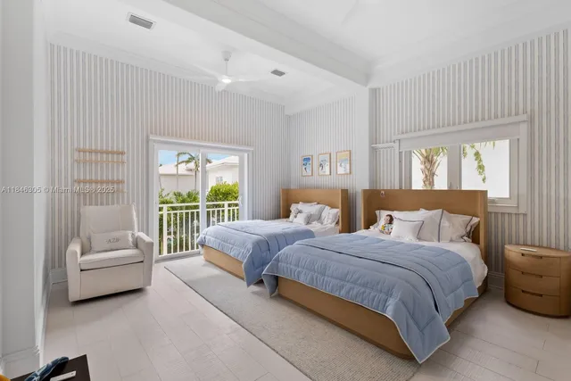 a spacious bedroom with a bed and a couch