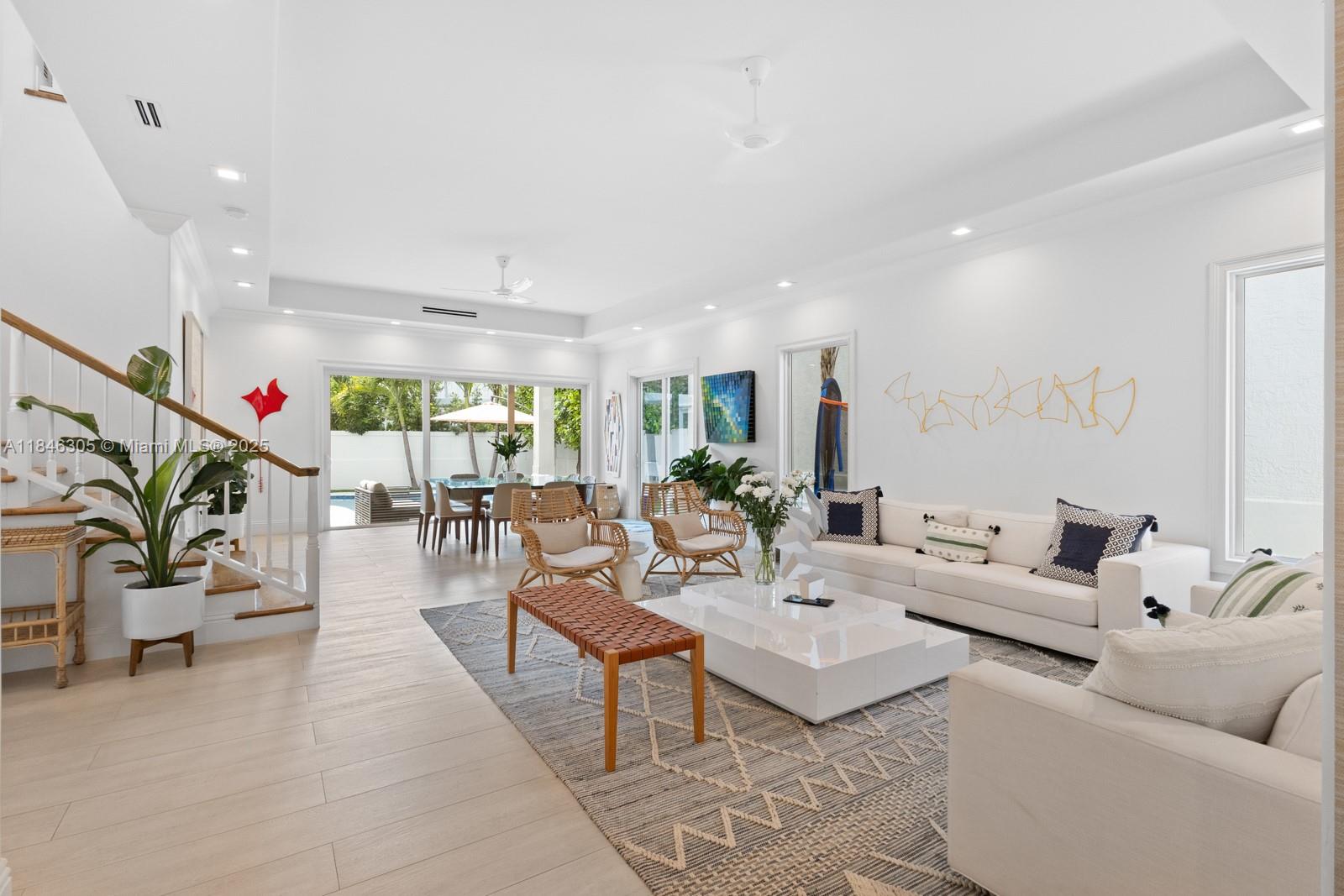 5 Coconut Lane Key Biscayne, FL 33149 - Photo 2 of 41 a living room with furniture and a potted plant