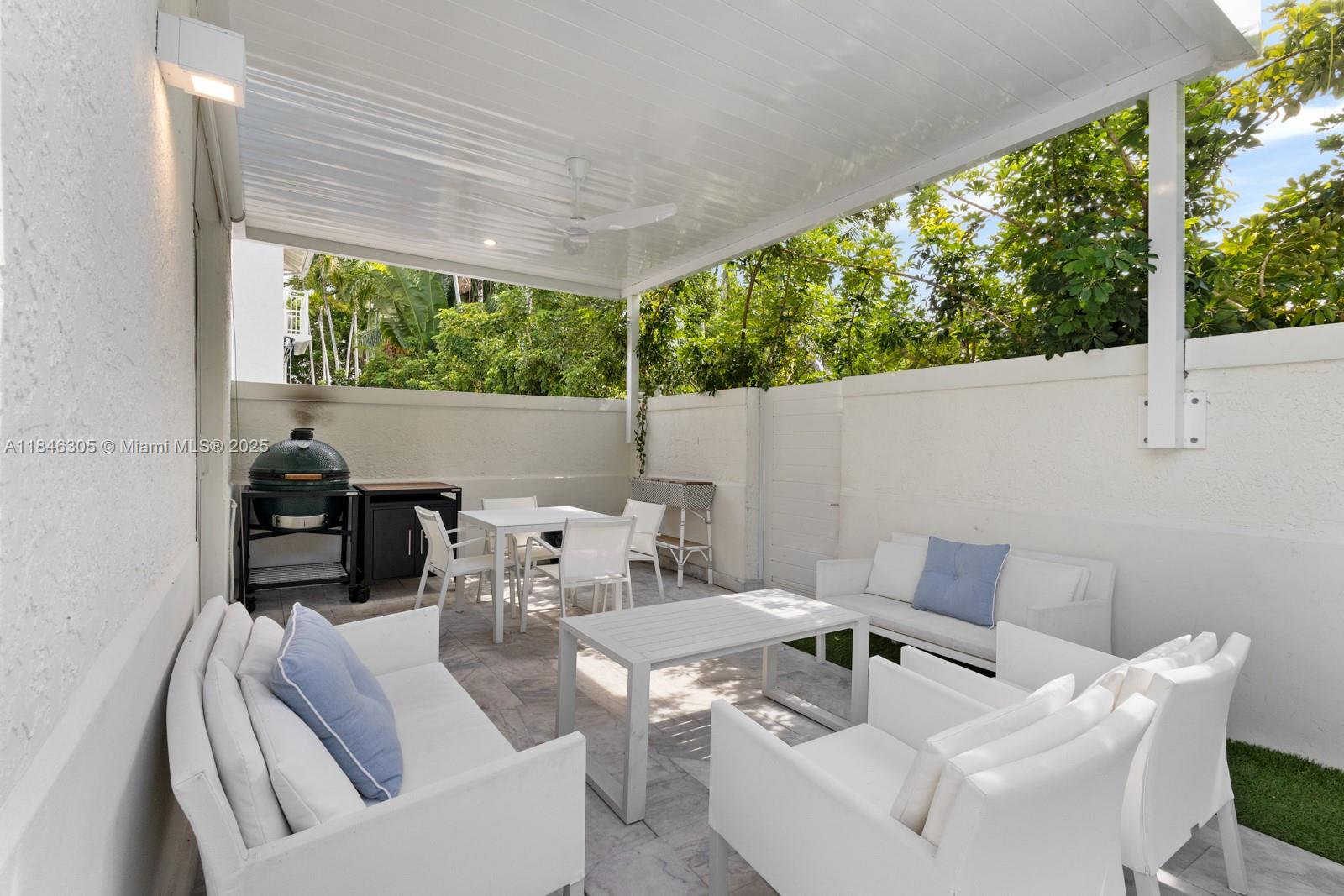 5 Coconut Lane Key Biscayne, FL 33149 - Photo 37 of 41 a outdoor living space with furniture and garden view