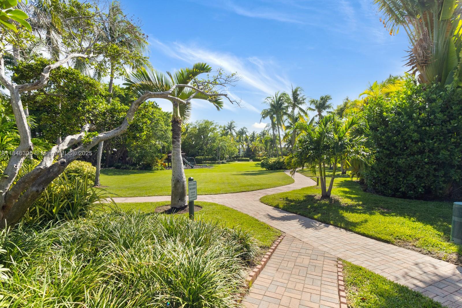 5 Coconut Lane Key Biscayne, FL 33149 - Photo 38 of 41 a view of a garden with a slide