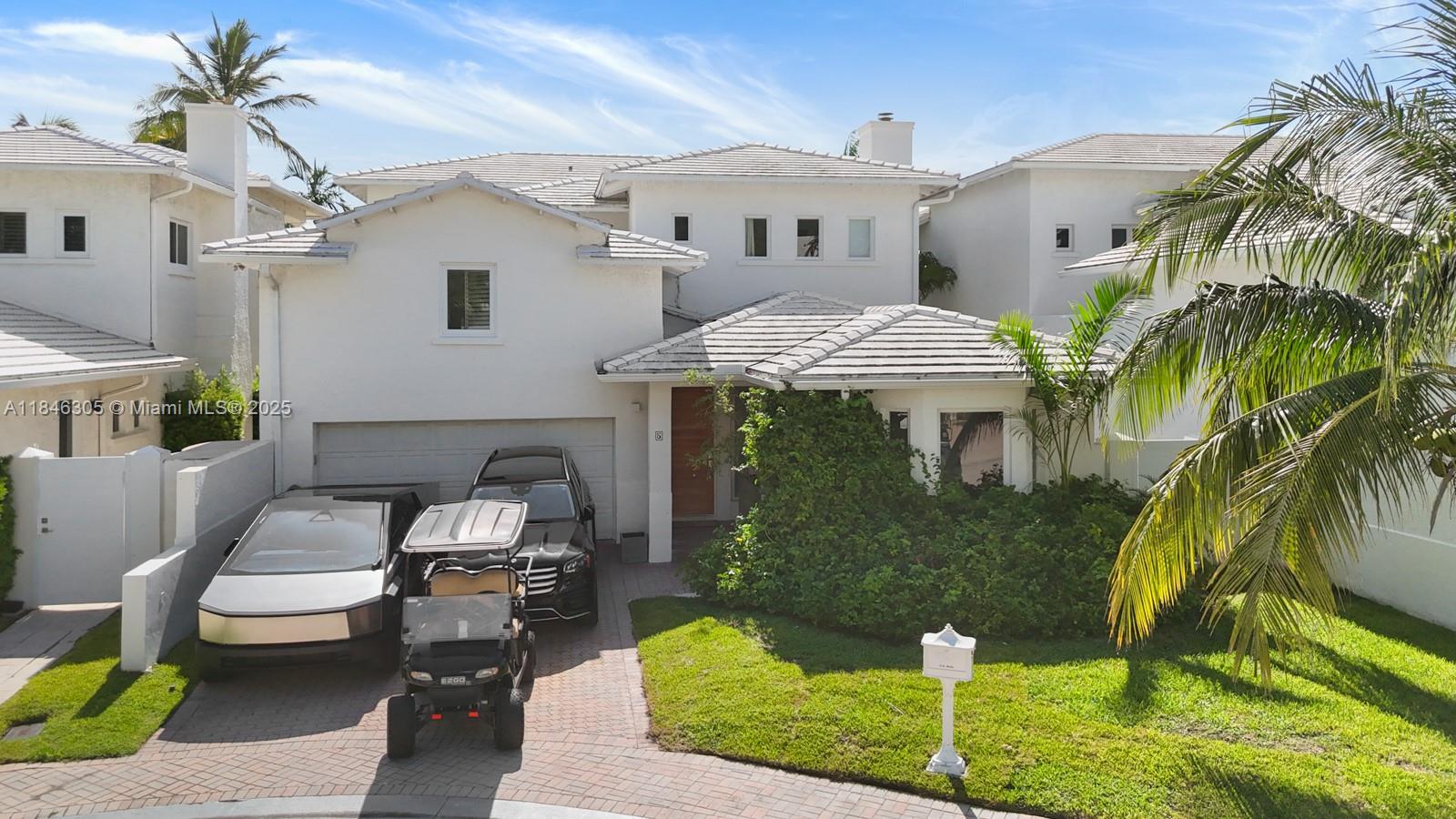 5 Coconut Lane Key Biscayne, FL 33149 - Photo 40 of 41 a front view of a house with garden