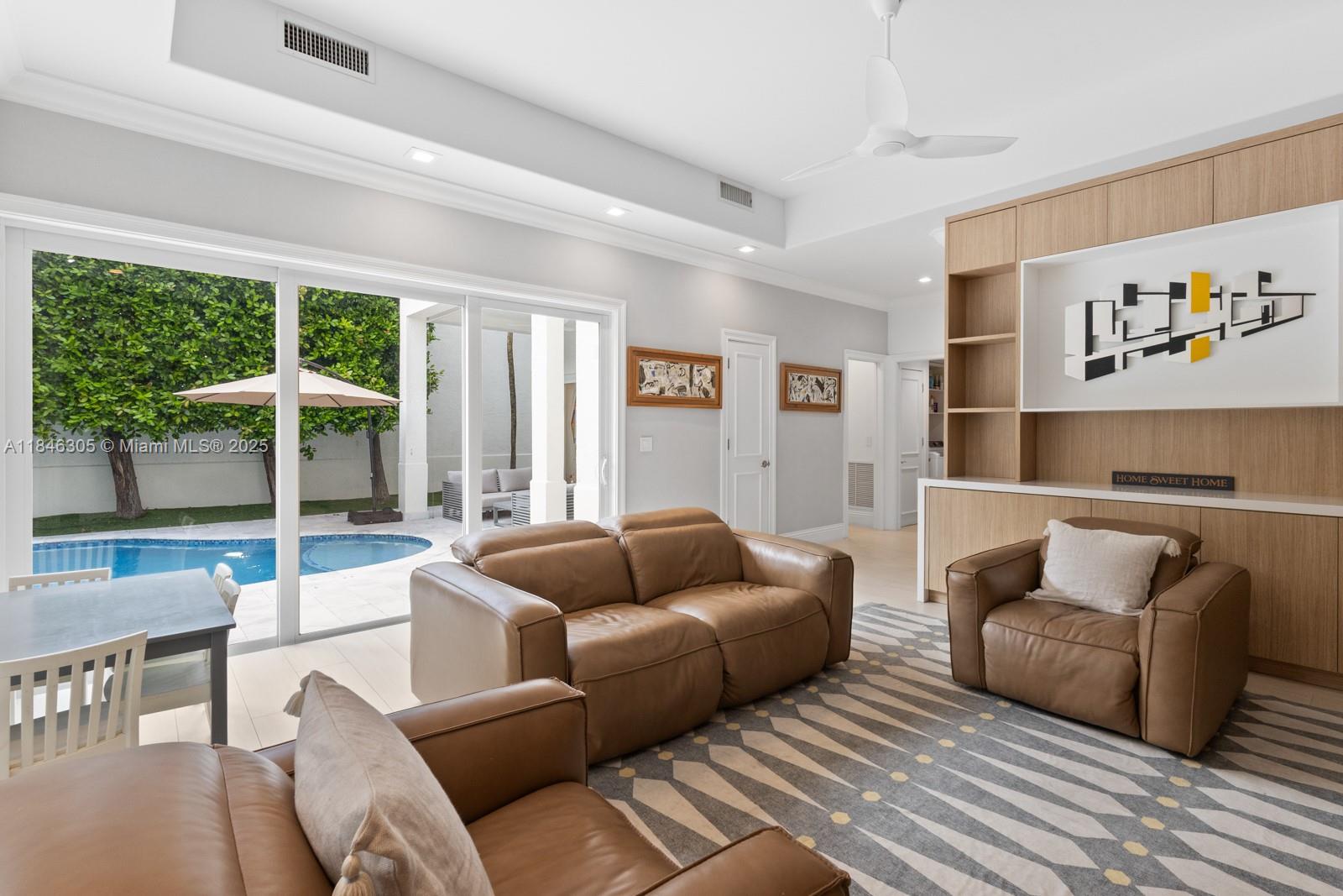 5 Coconut Lane Key Biscayne, FL 33149 - Photo 10 of 41 a living room with furniture and a large window