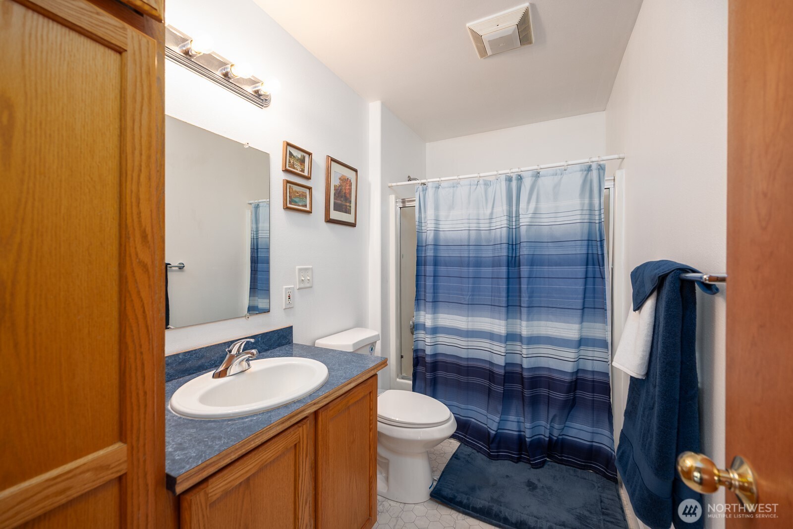 2207 West Depot Springs Road Spangle, WA 99031 - Photo 11 of 26 a bathroom with a sink a toilet and shower