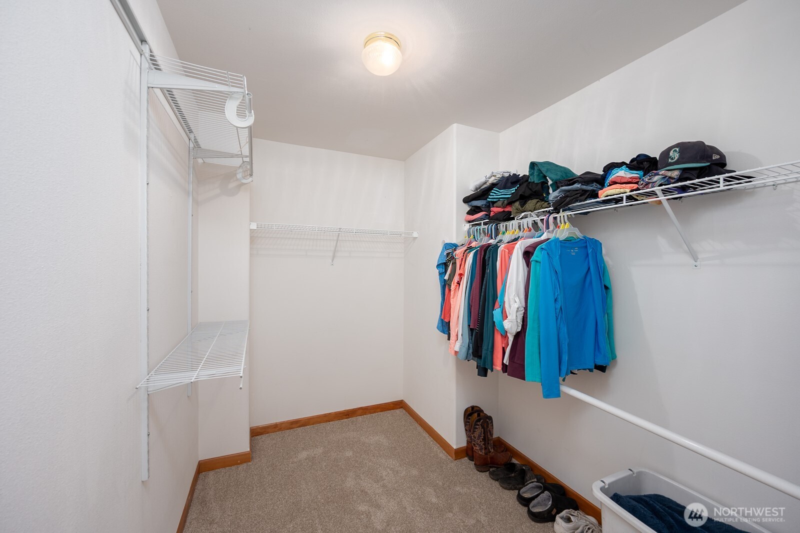 2207 West Depot Springs Road Spangle, WA 99031 - Photo 14 of 26 a view of walk in closet with clothes and shoes