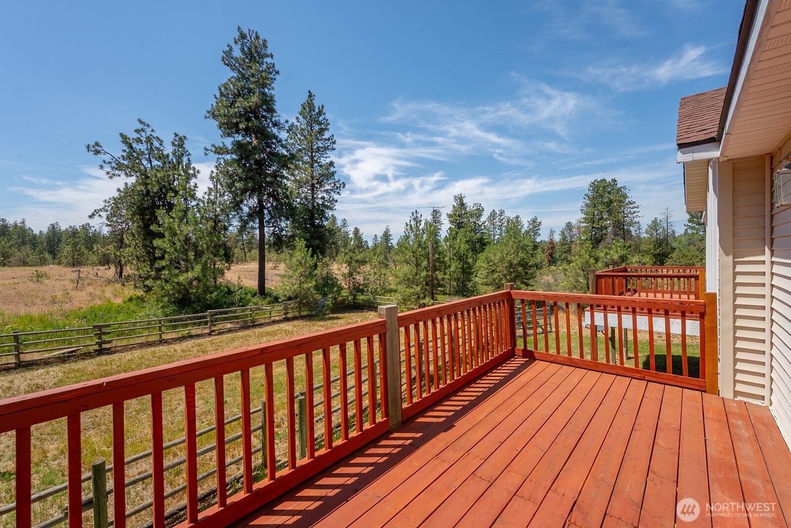 2207 West Depot Springs Road Spangle, WA 99031 - Photo 15 of 26 a view of balcony with wooden floor and fence