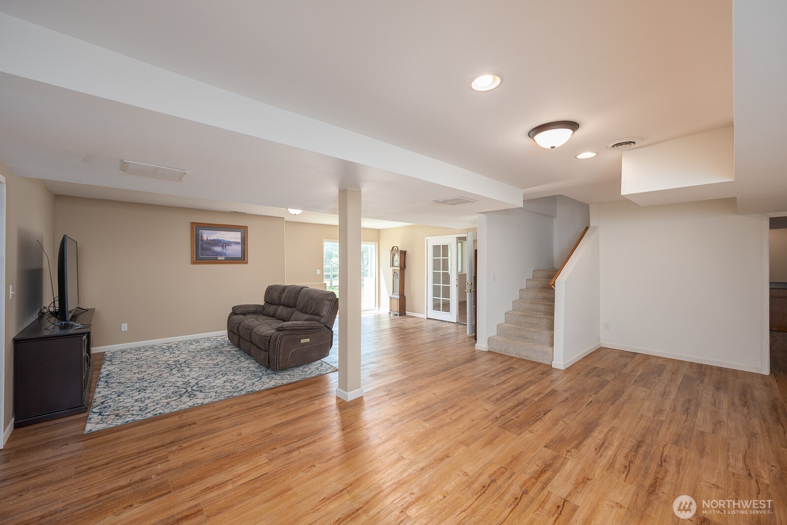 2207 West Depot Springs Road Spangle, WA 99031 - Photo 18 of 26 a living room with furniture and a wooden floor