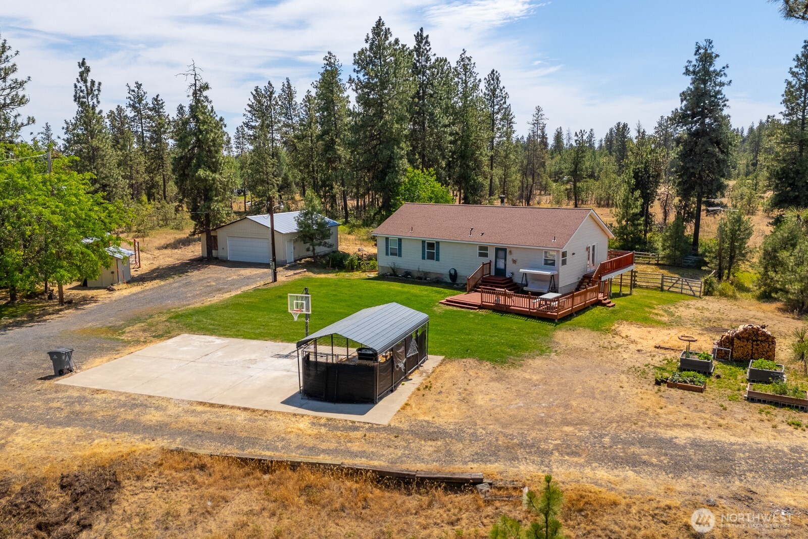 2207 West Depot Springs Road Spangle, WA 99031 - Photo 2 of 26 an aerial view of a house with garden space and sitting area