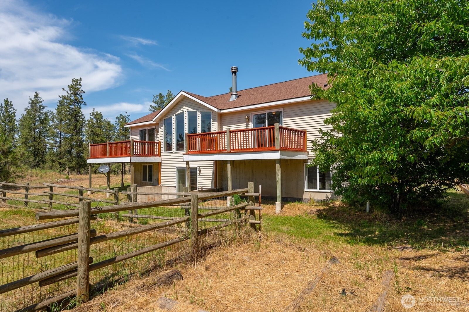 2207 West Depot Springs Road Spangle, WA 99031 - Photo 3 of 26 a front view of a house with a yard