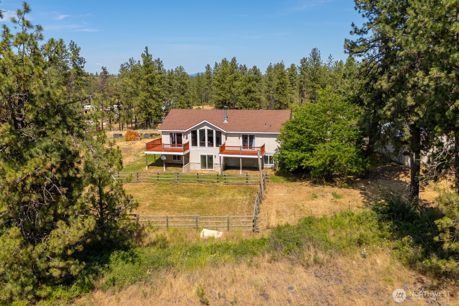 2207 West Depot Springs Road Spangle, WA 99031 - Photo 4 of 26 a front view of a house with a yard
