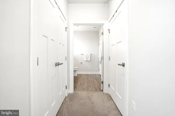 a view of a bathroom from a hallway