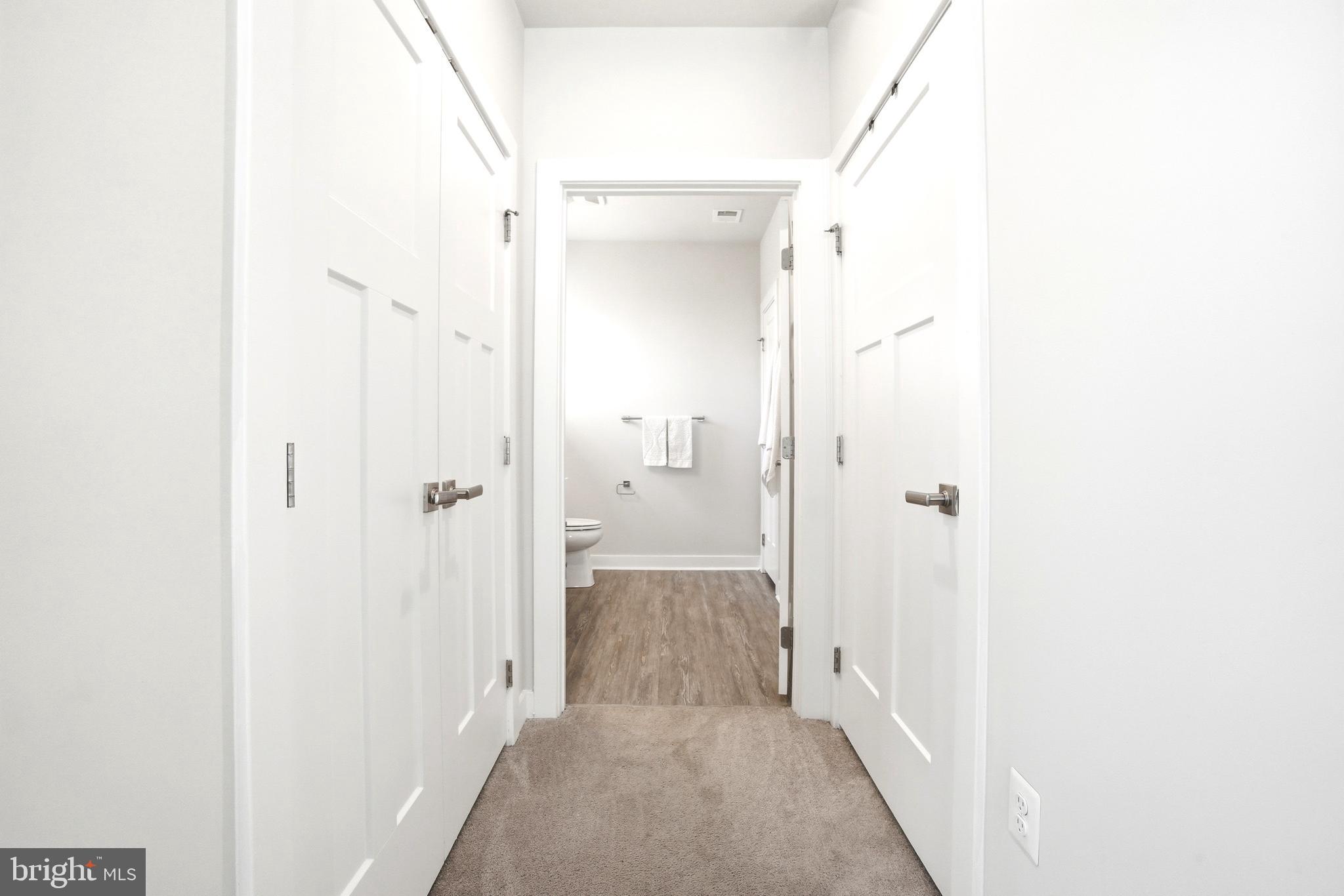 10020 Ruffian Way, Unit A Laurel, MD 20723 - Photo 18 of 36 a view of a bathroom from a hallway