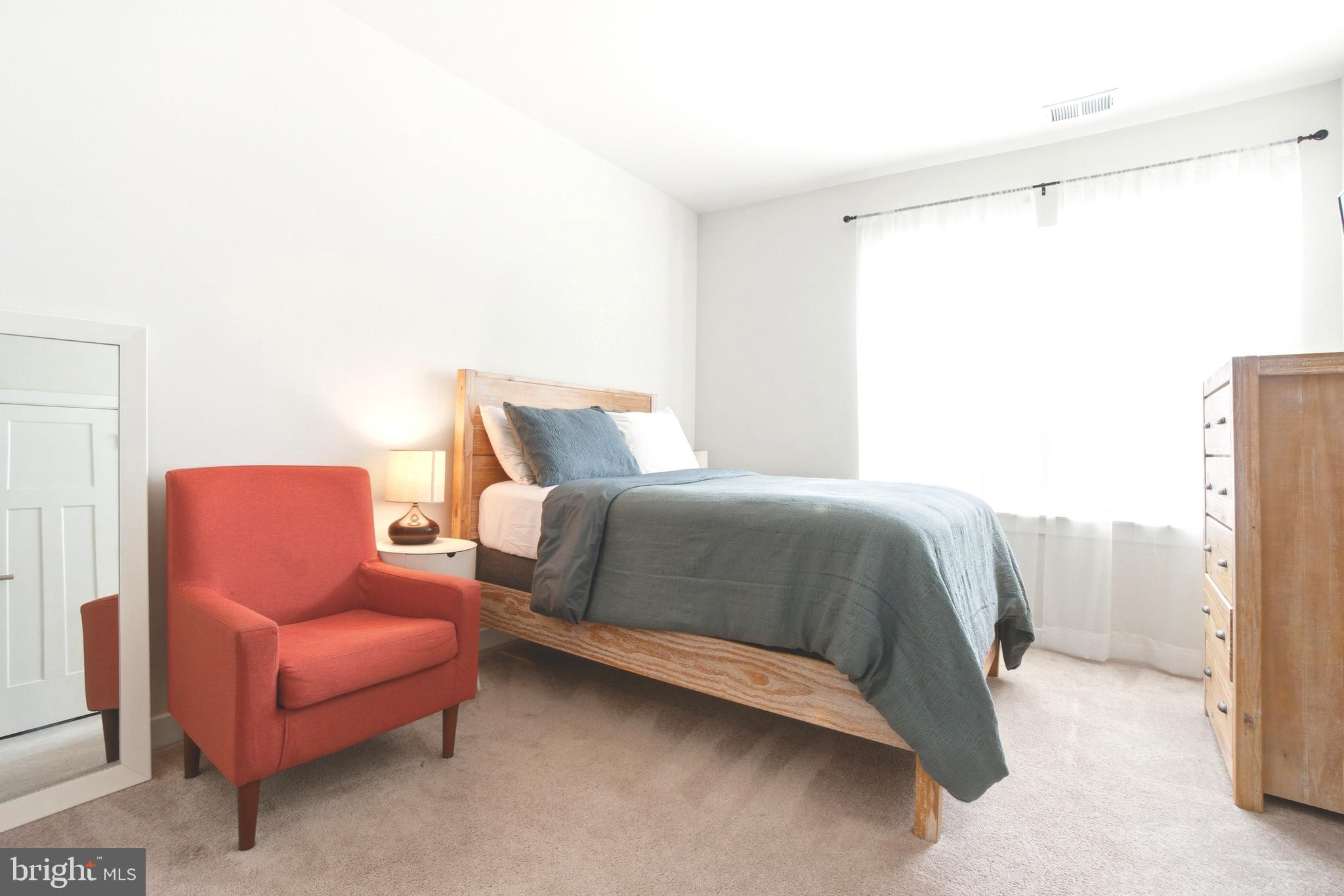 10020 Ruffian Way, Unit A Laurel, MD 20723 - Photo 19 of 36 a bedroom with a bed and a couch