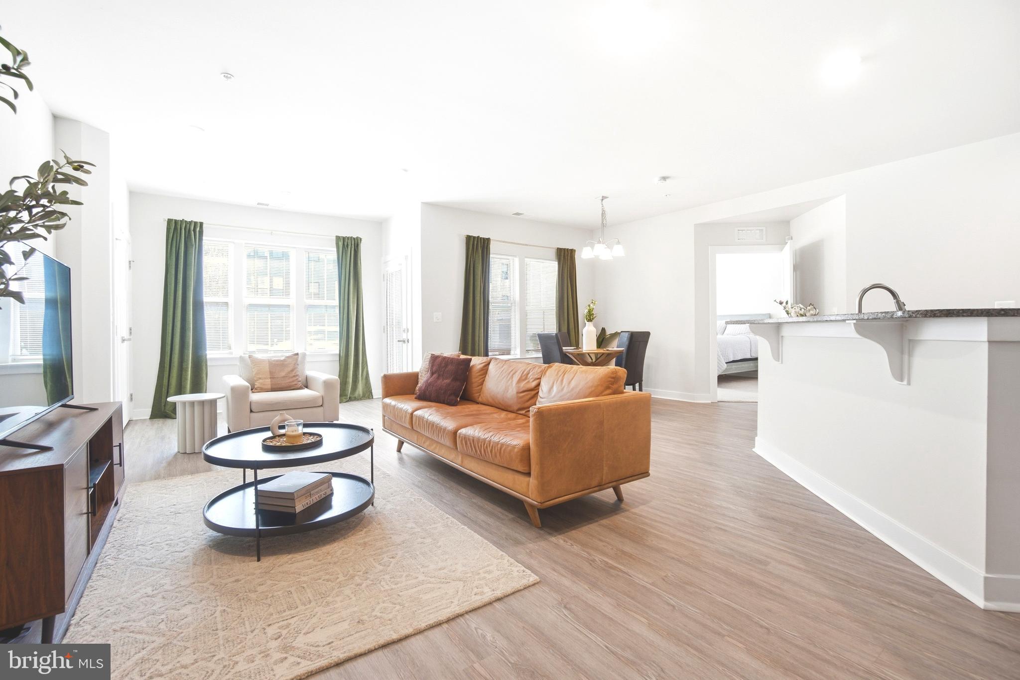10020 Ruffian Way, Unit A Laurel, MD 20723 - Photo 2 of 36 a living room with furniture and a window