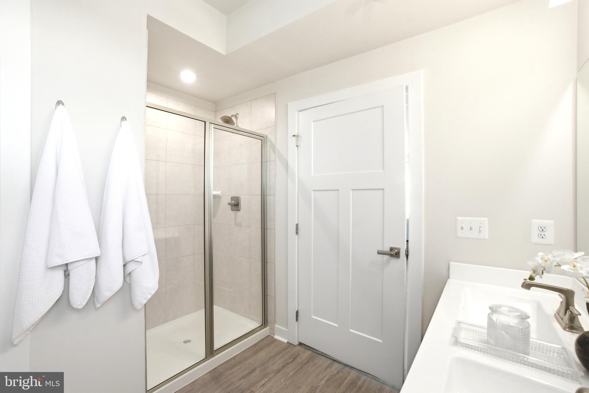 10020 Ruffian Way, Unit A Laurel, MD 20723 - Photo 22 of 36 a bathroom with a shower and a sink