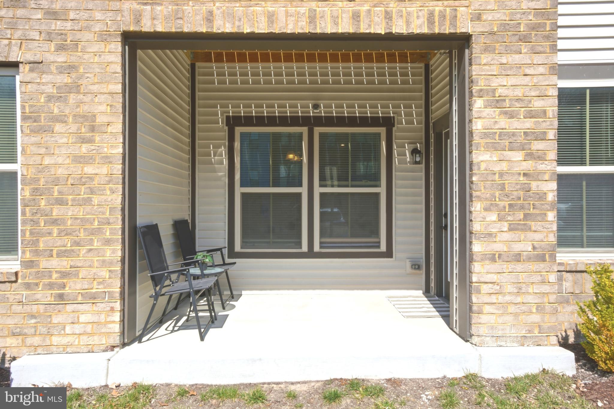 10020 Ruffian Way, Unit A Laurel, MD 20723 - Photo 24 of 36 a front view of a house with a yard