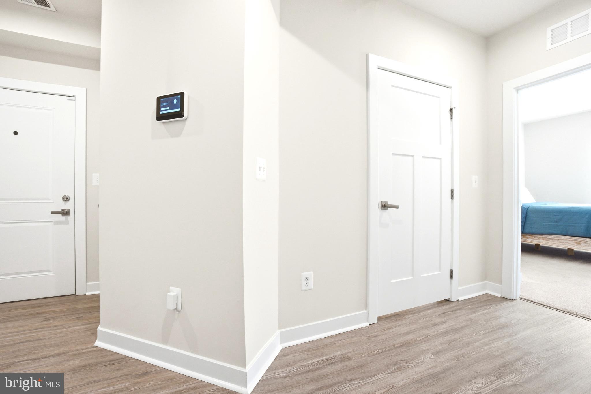 10020 Ruffian Way, Unit A Laurel, MD 20723 - Photo 26 of 36 a view of a livingroom with wooden floor