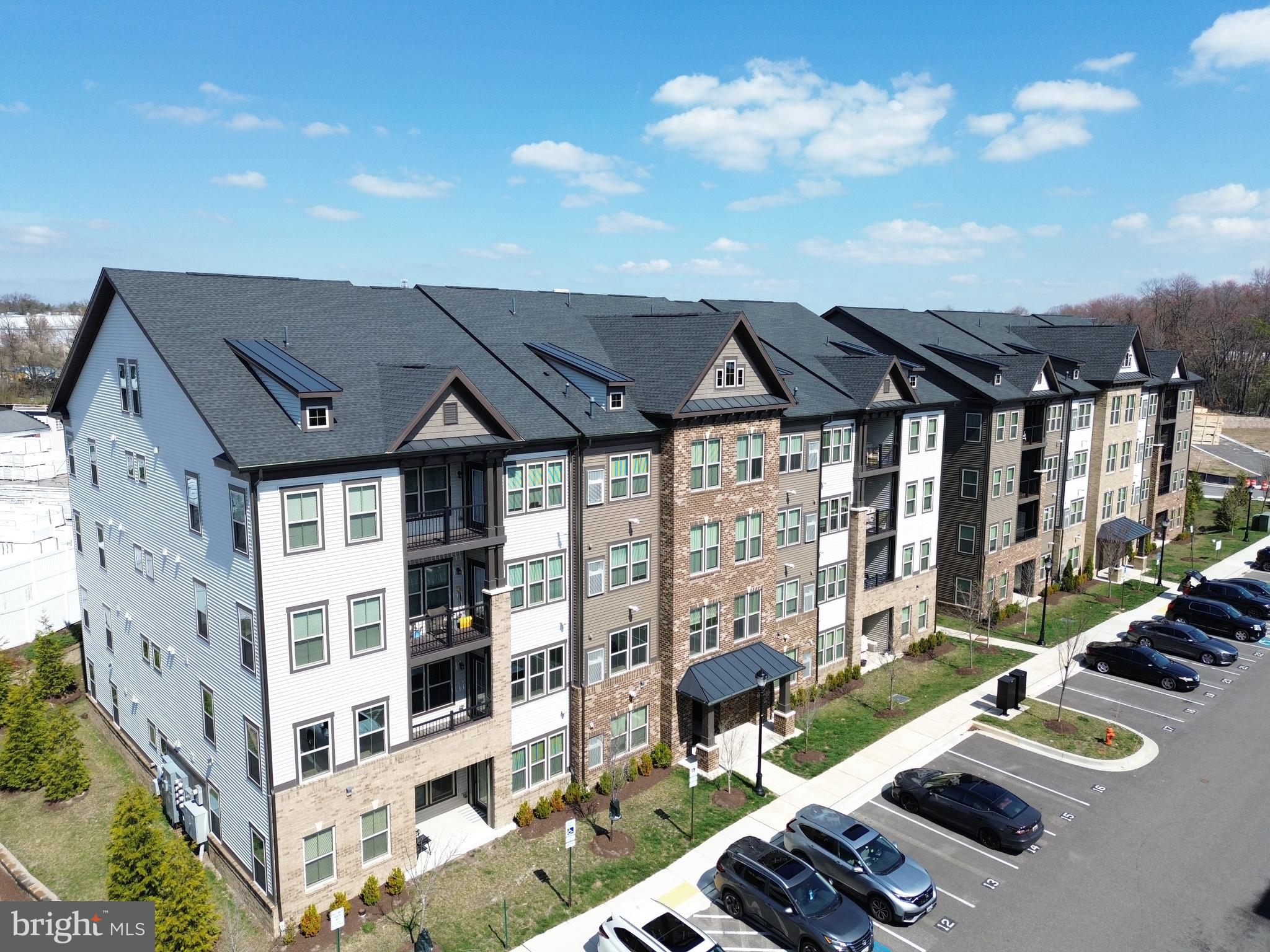 10020 Ruffian Way, Unit A Laurel, MD 20723 - Photo 29 of 36 a view of a house with pool and chairs