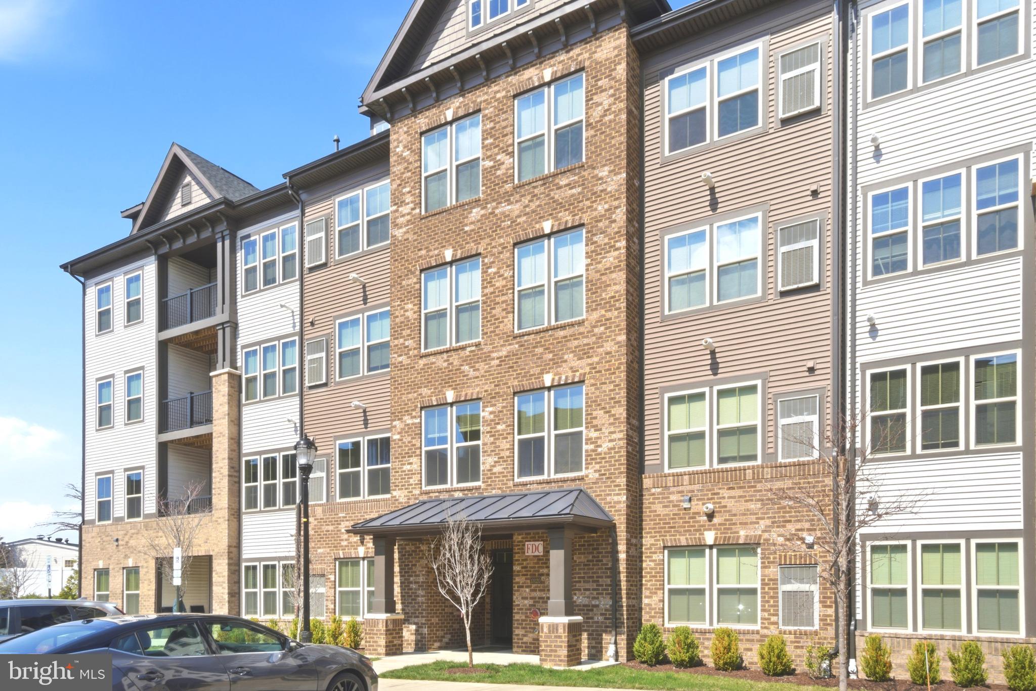 10020 Ruffian Way, Unit A Laurel, MD 20723 - Photo 33 of 36 a front view of a building with a lot of windows