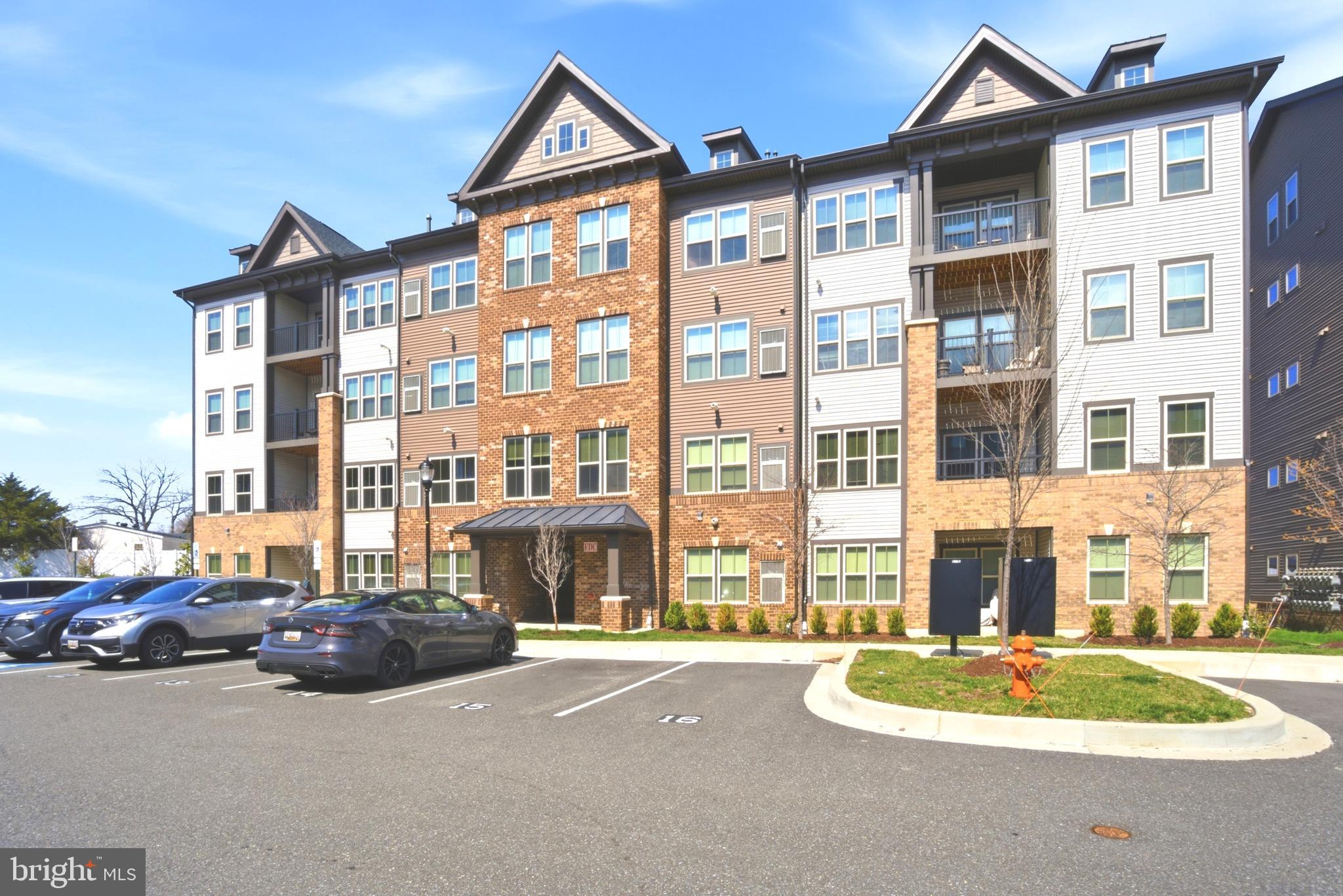 10020 Ruffian Way, Unit A Laurel, MD 20723 - Photo 34 of 36 a front view of a house with a yard
